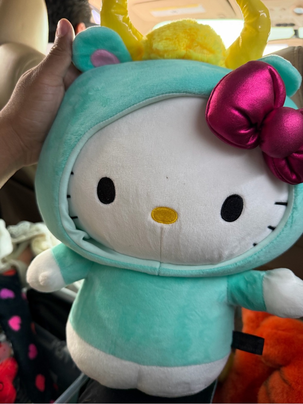 Hello Kitty Plush in Teal Costume with Metallic Pink Bow and Yellow Accent